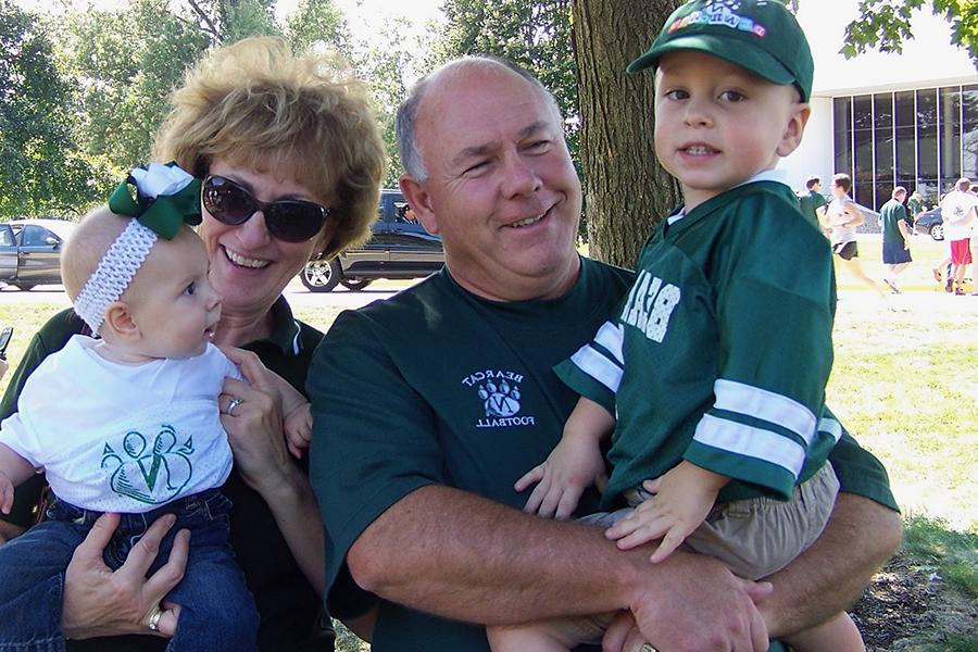 The Place family has maintained their strong connection with the University from Ted's parents, Chuck and Linda, to his children Ben and Claire, pictured at a Bearcat football tailgate in 2009.